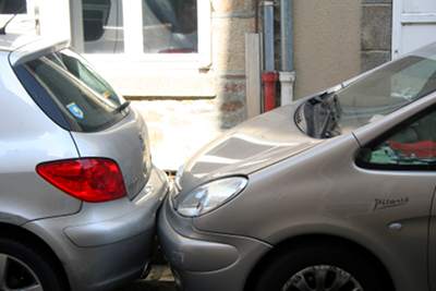 two cars parked very closely